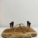 Pair of teak and brass candlesticks