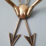 Vintage wall lamp decorated with bronze arrows