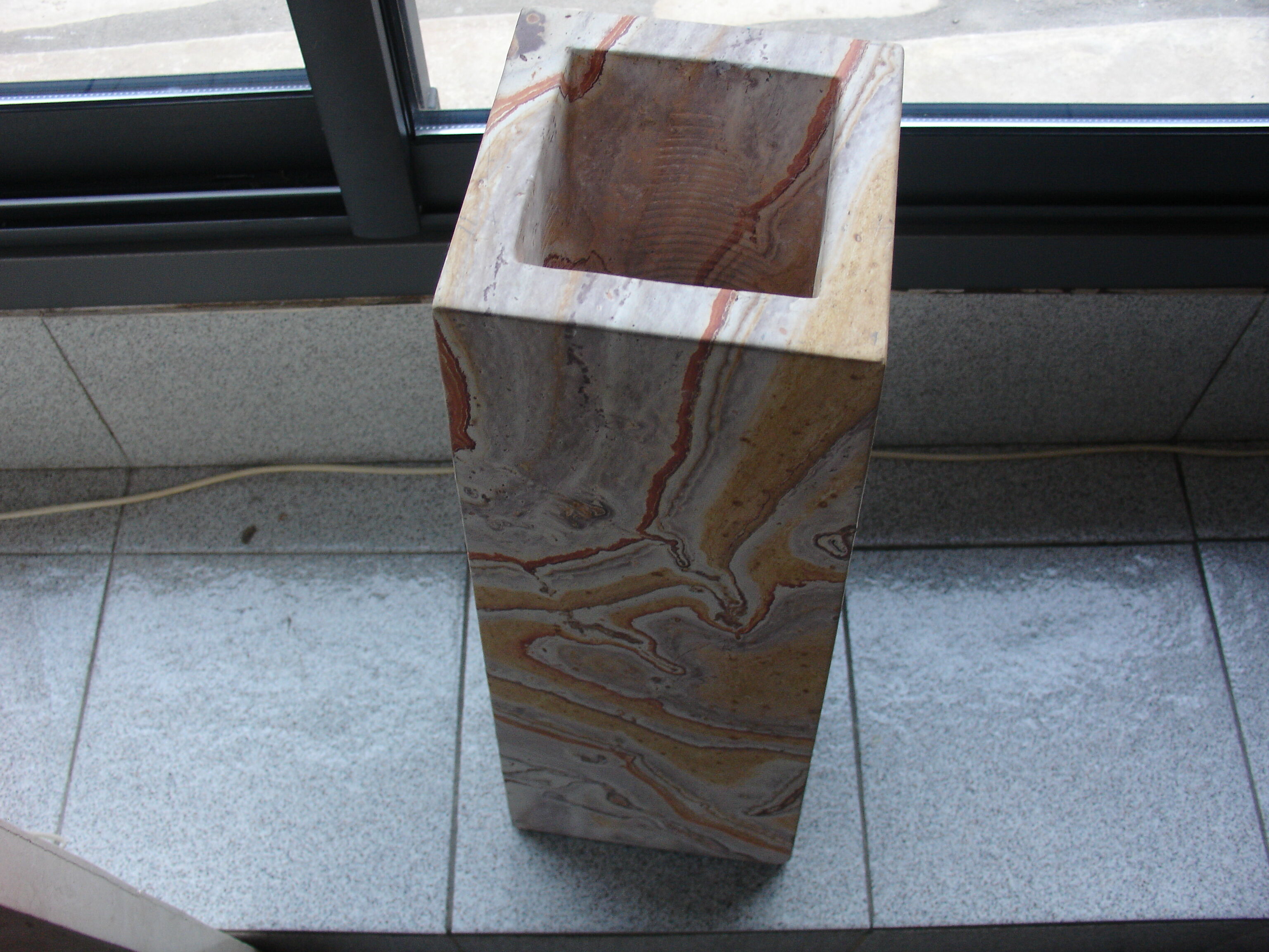 Floor vase in serpentine marble carved from a single block