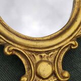 Classic Baroque/Louis XV style mirror. In old gold patinated wood. Palmette/Scroll/Blazon motif decor. Dim 46 x 27 cm