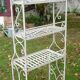 White wrought iron folding shelf