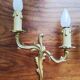 Pair of appliques with two arms of light with a leafy decoration