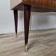 Mid-century drawer chest in mahogany, brass and glass.
