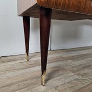 Mid-century drawer chest in mahogany, brass and glass.