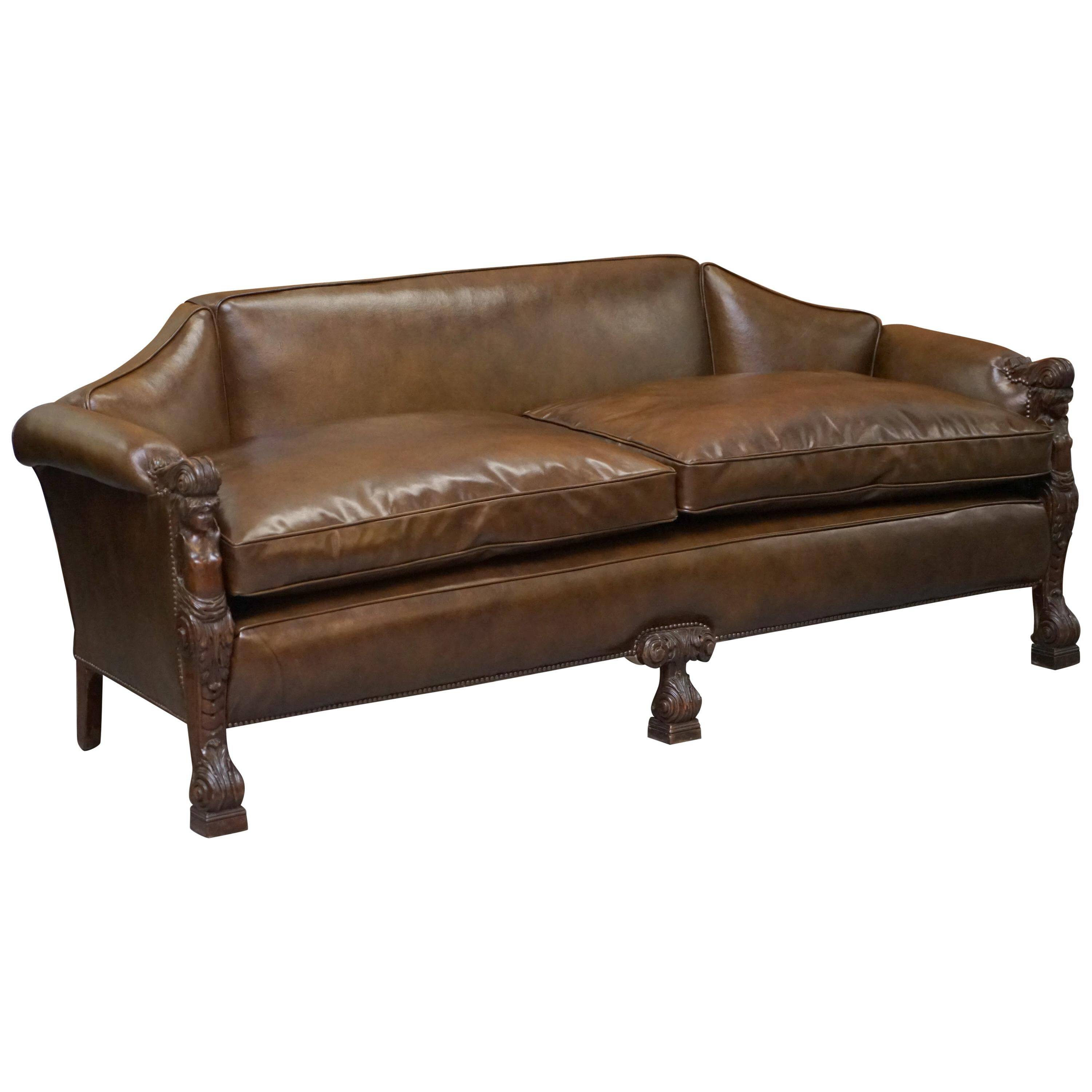 Restored Regency canapé in leather with sculpted Hermès frame.