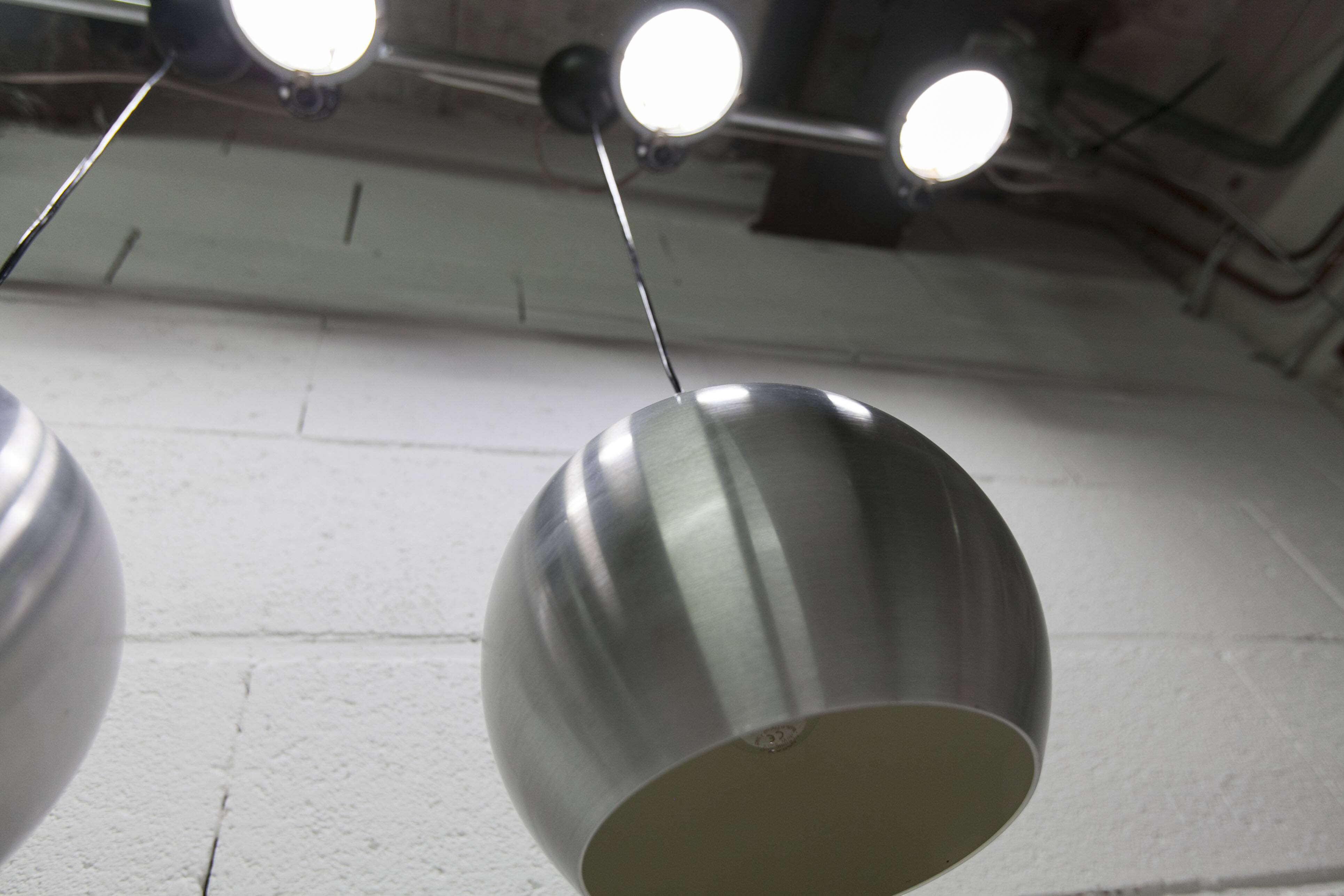 Pair of functional 70's aluminum ball pendants