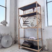 Rattan bookshelf and black glasses