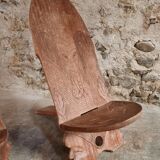 Pair of hand-carved wooden folding chairs – African origin, animal and face motifs, mid-20th century