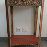 Console, small red accent table.