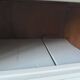 Small vintage piece of furniture sublimated in a linen shade, wooden top.