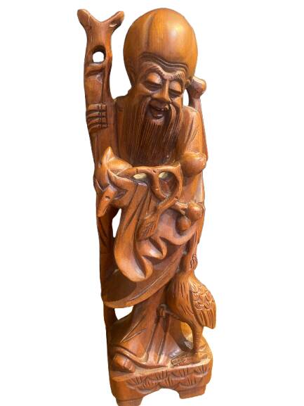 Carved wooden table lamp representing a man