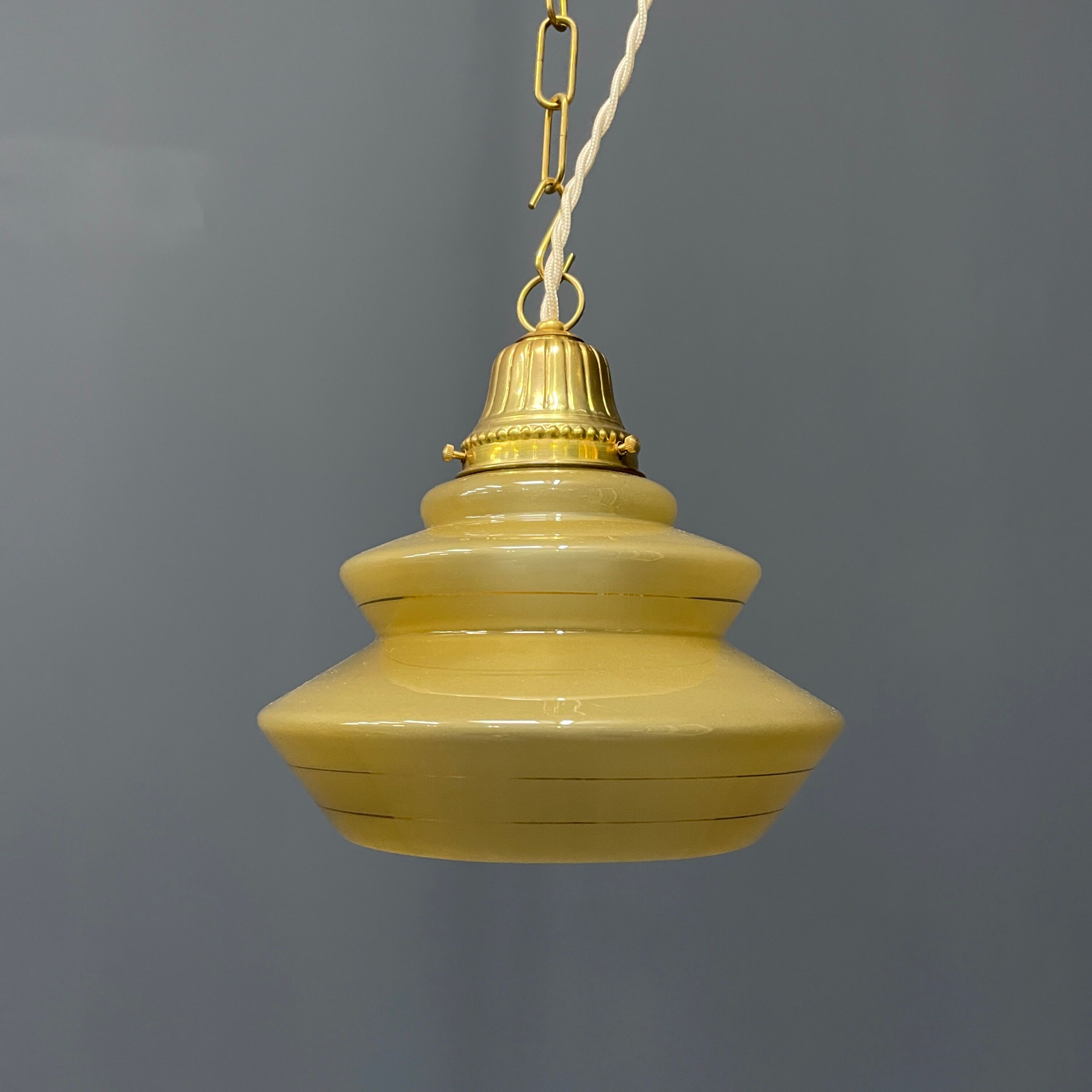 Vintage ocher glass hanging lamps with brass gallery