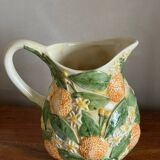 Orange slipware pitcher