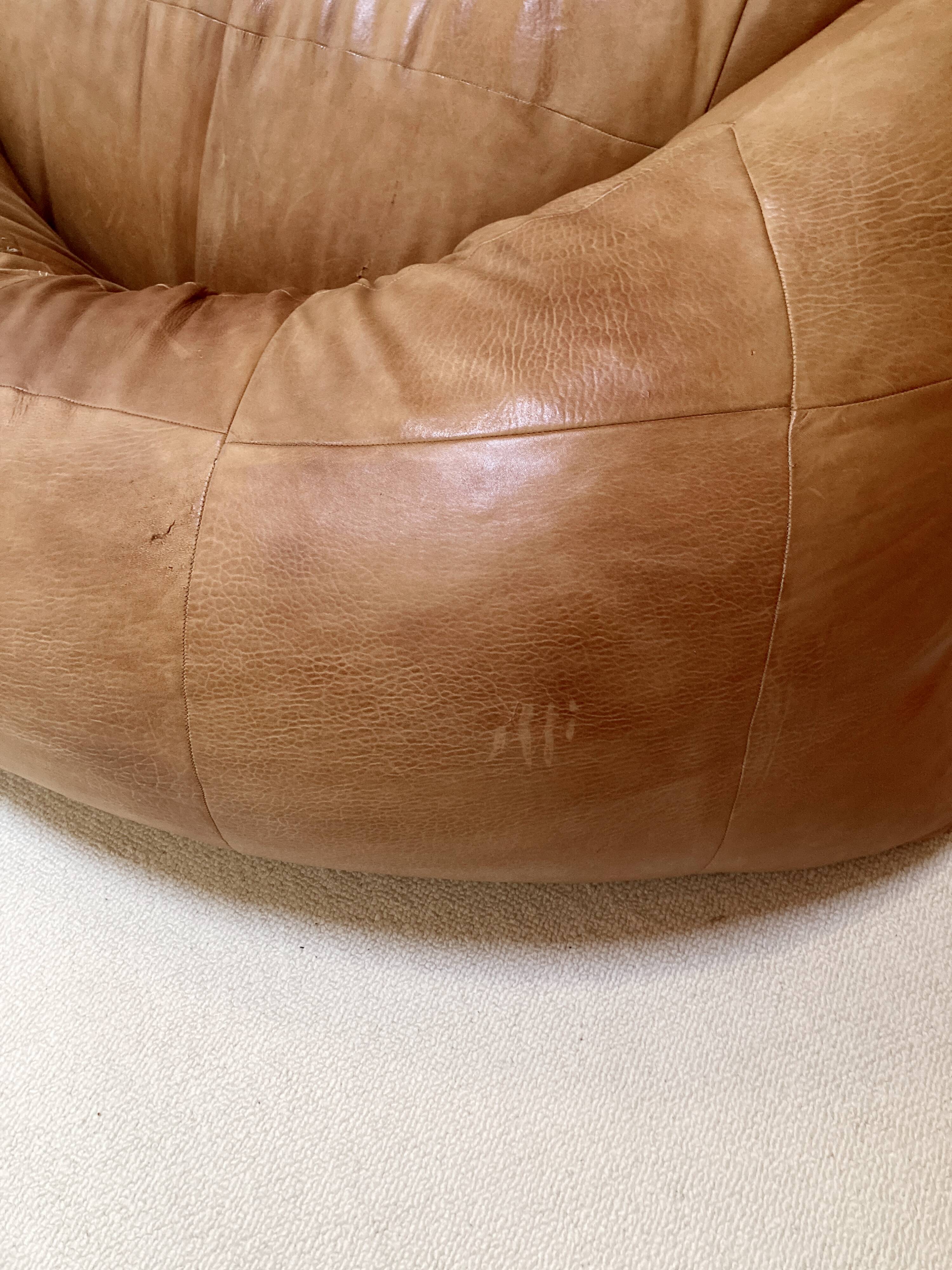 Two-seater leather pouf sofa by Raphaël Raffel for Honoré Paris