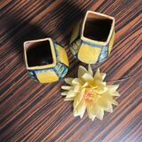 A pair of green and yellow vases