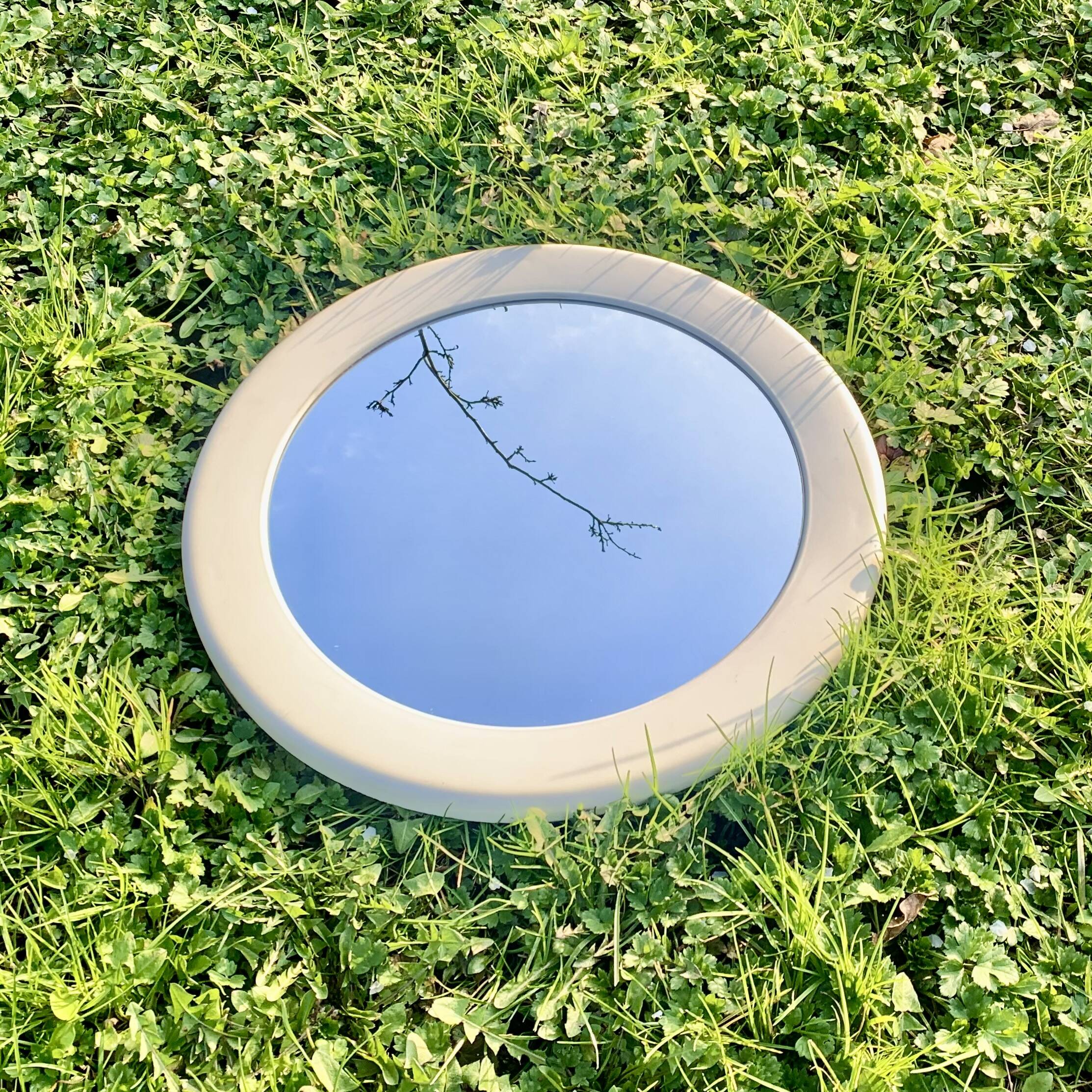 Vintage round white plastic mirror