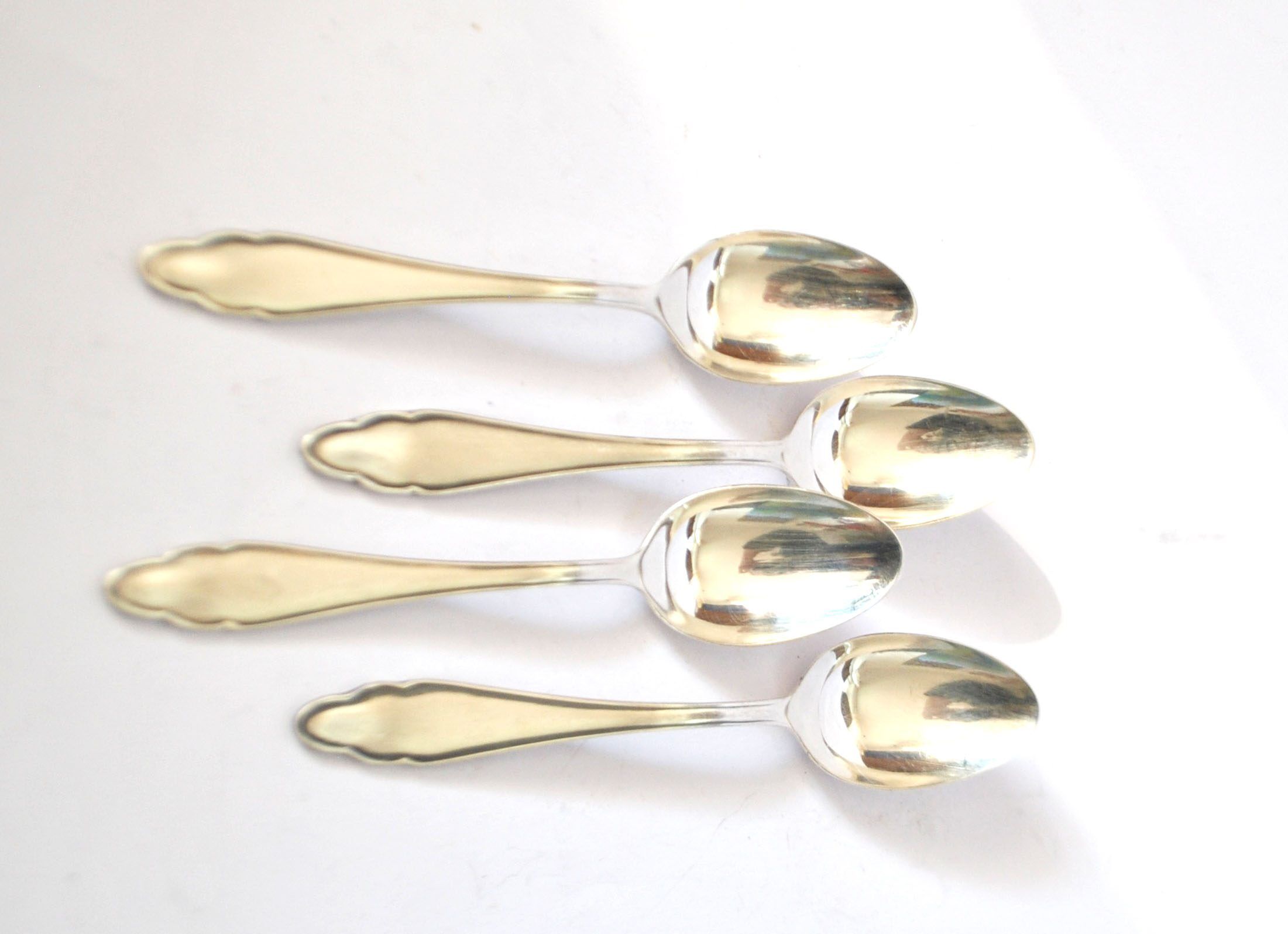 DEETJEN set of 4 silver-plated dessert spoons with a modernist scalloped design.