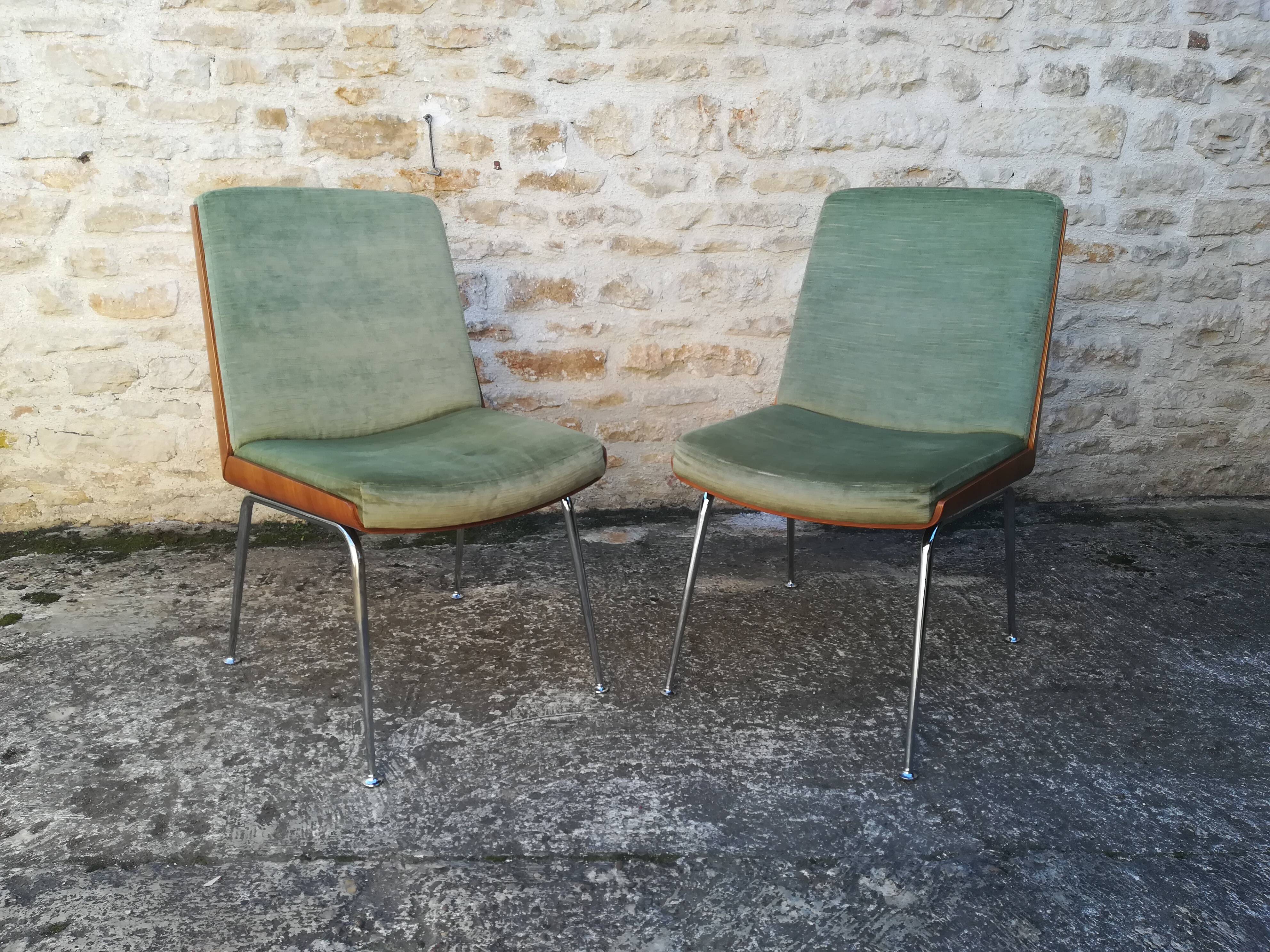 Shell chairs and green fabric