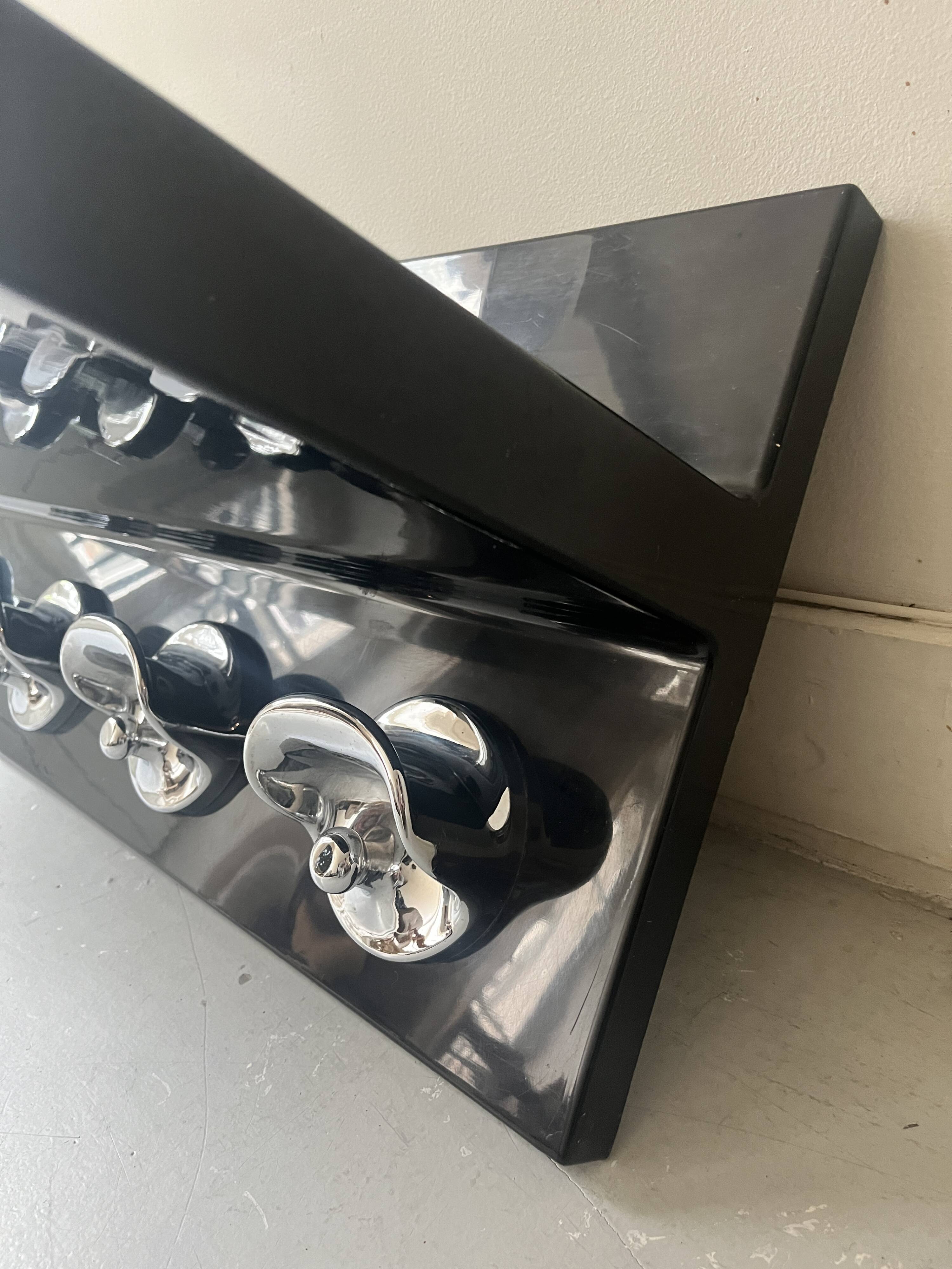 Large black magazine rack by Giotto Stoppino for Kartell, Italy 1970.