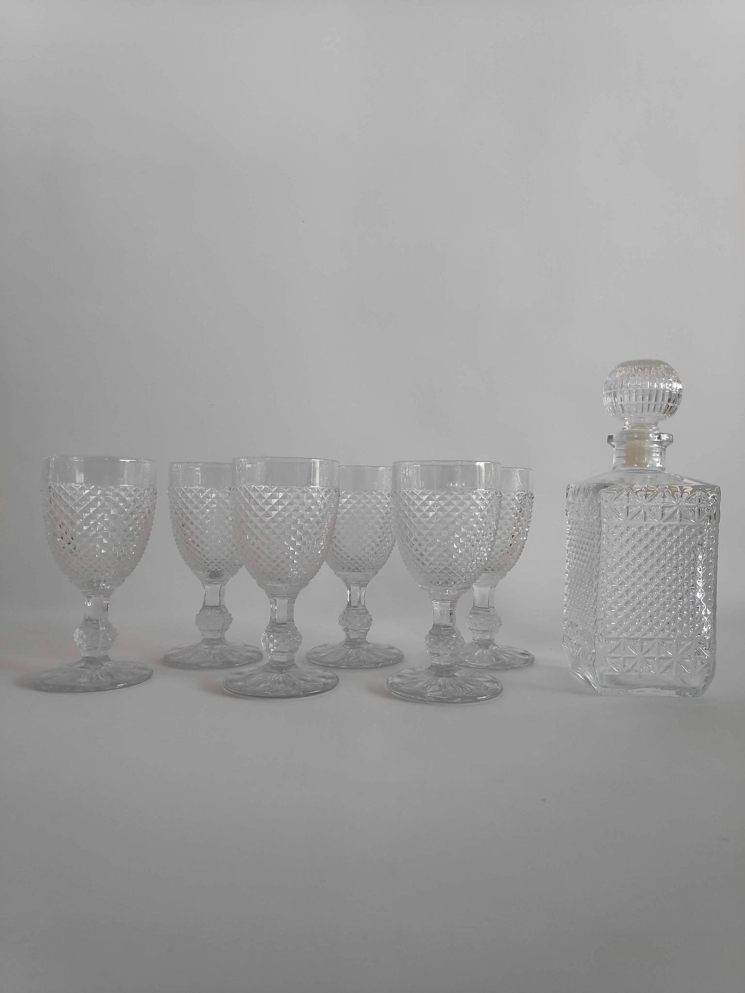 Vintage molded glass foot glasses and carafe from the years 60