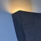 Graphical black stoneware ceramic wall light with handmade ring.