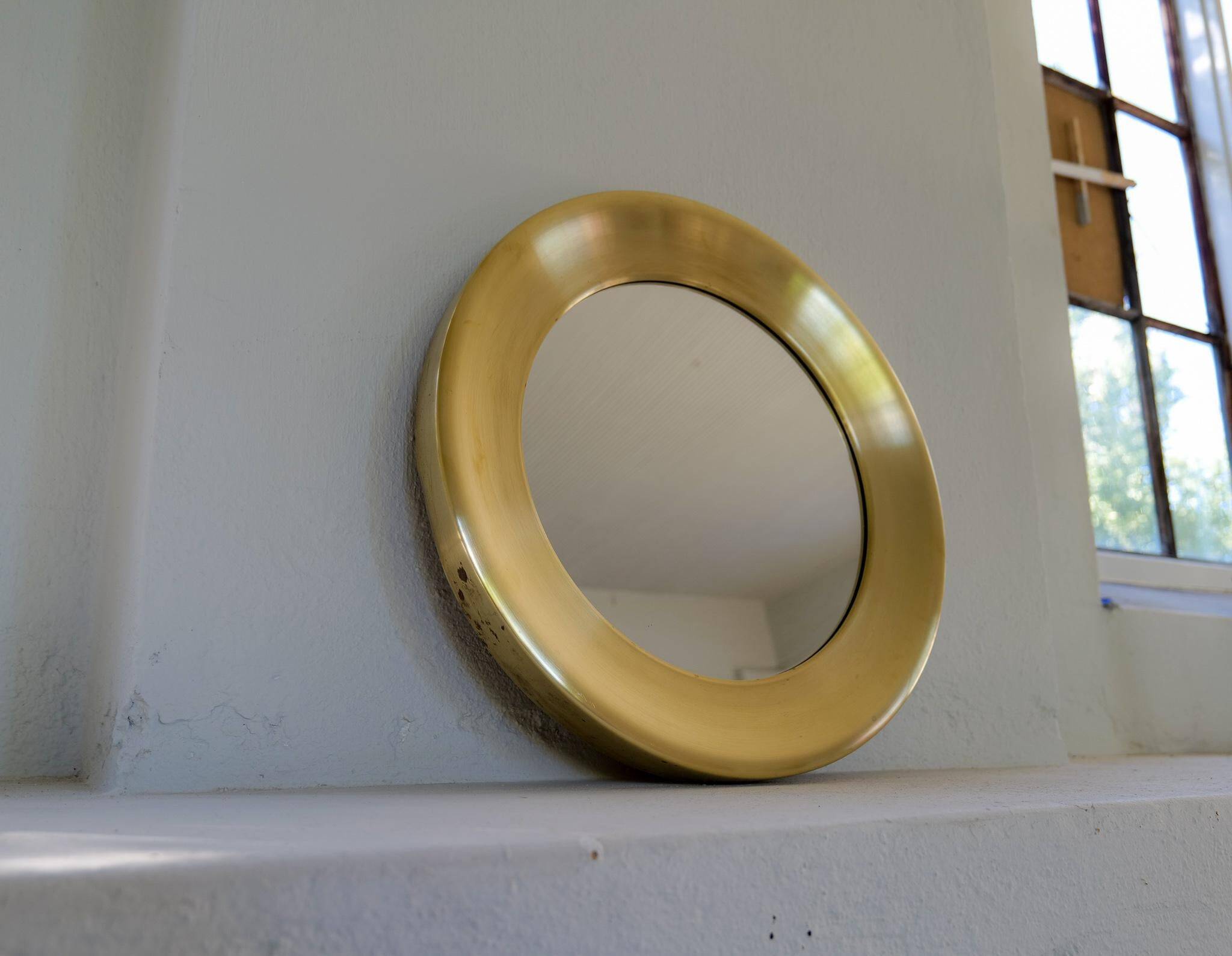 Modern round brass mirror from the mid-century by Glasmäster in Markaryd, Sweden, 1960s.