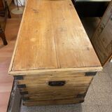 Old trunk in natural pine wood with padded interior
