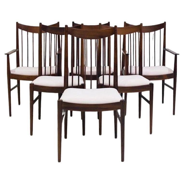 Set of six wooden dining chairs Arne Vodder Model No 422 with fabric upholstery.