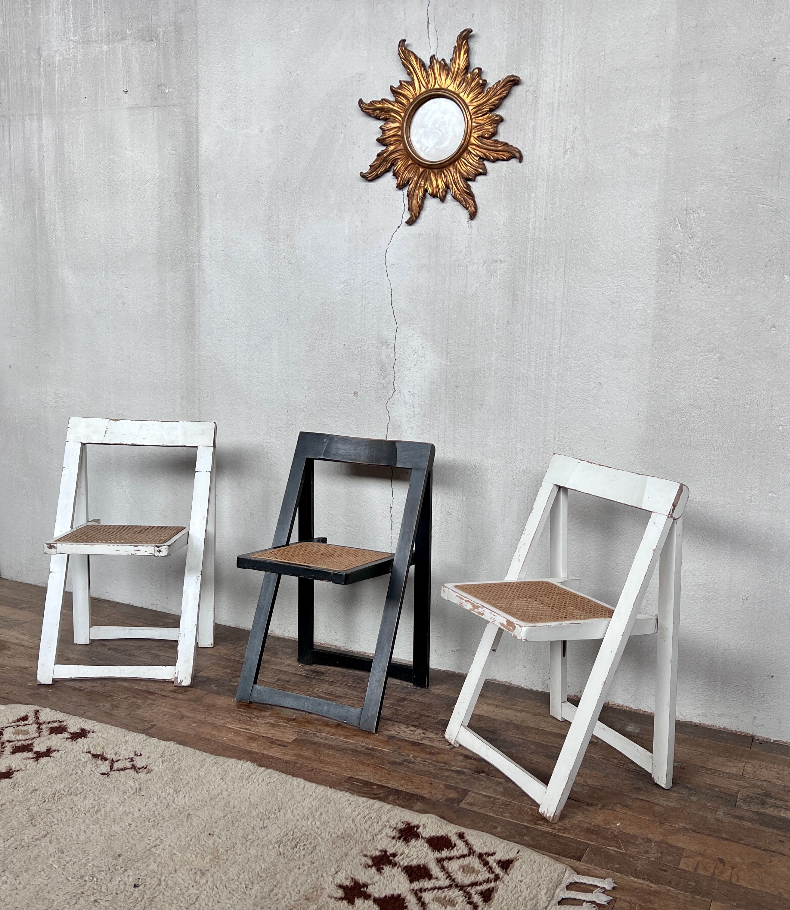 Trio of vintage folding chairs with canning and solid wood