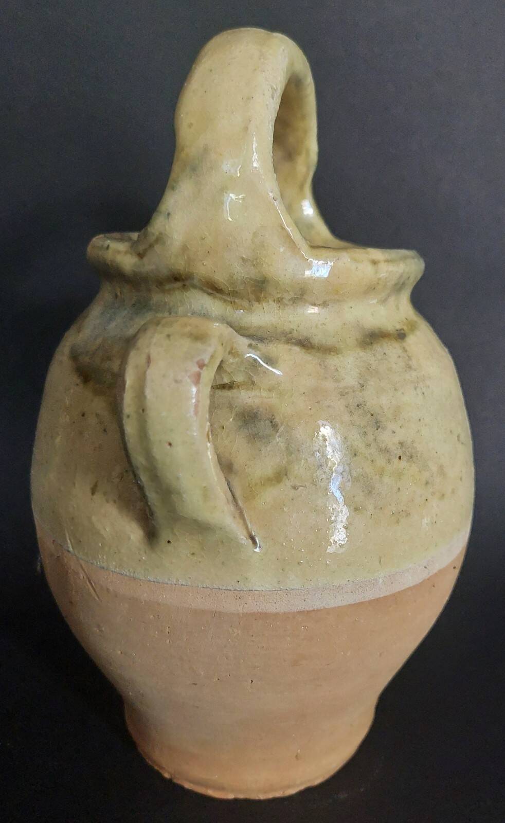 Yellow glazed terracotta gargoulette carafe with lid, early 20th century.