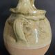 Yellow glazed terracotta gargoulette carafe with lid, early 20th century.