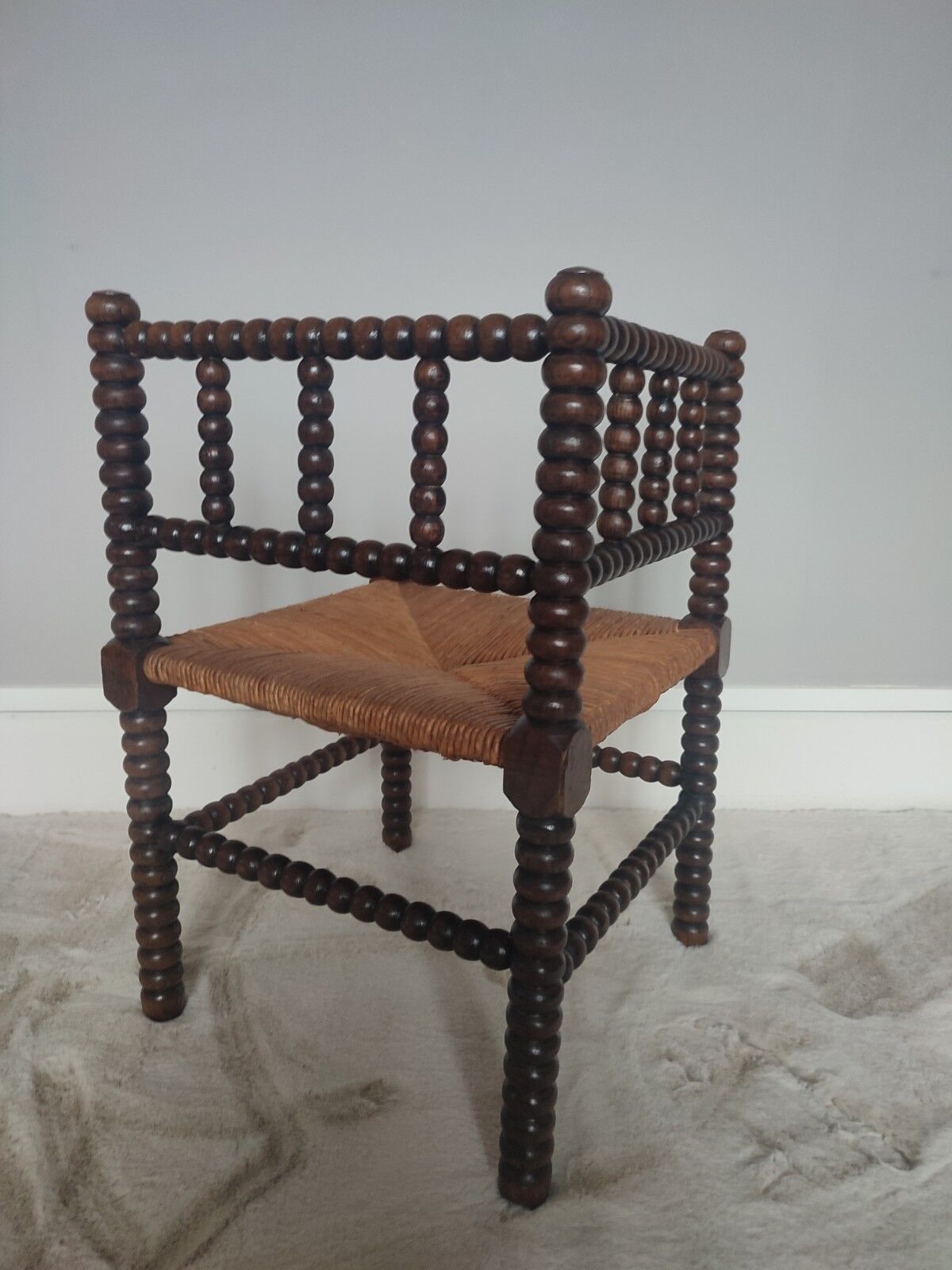 Turned wooden corner chair