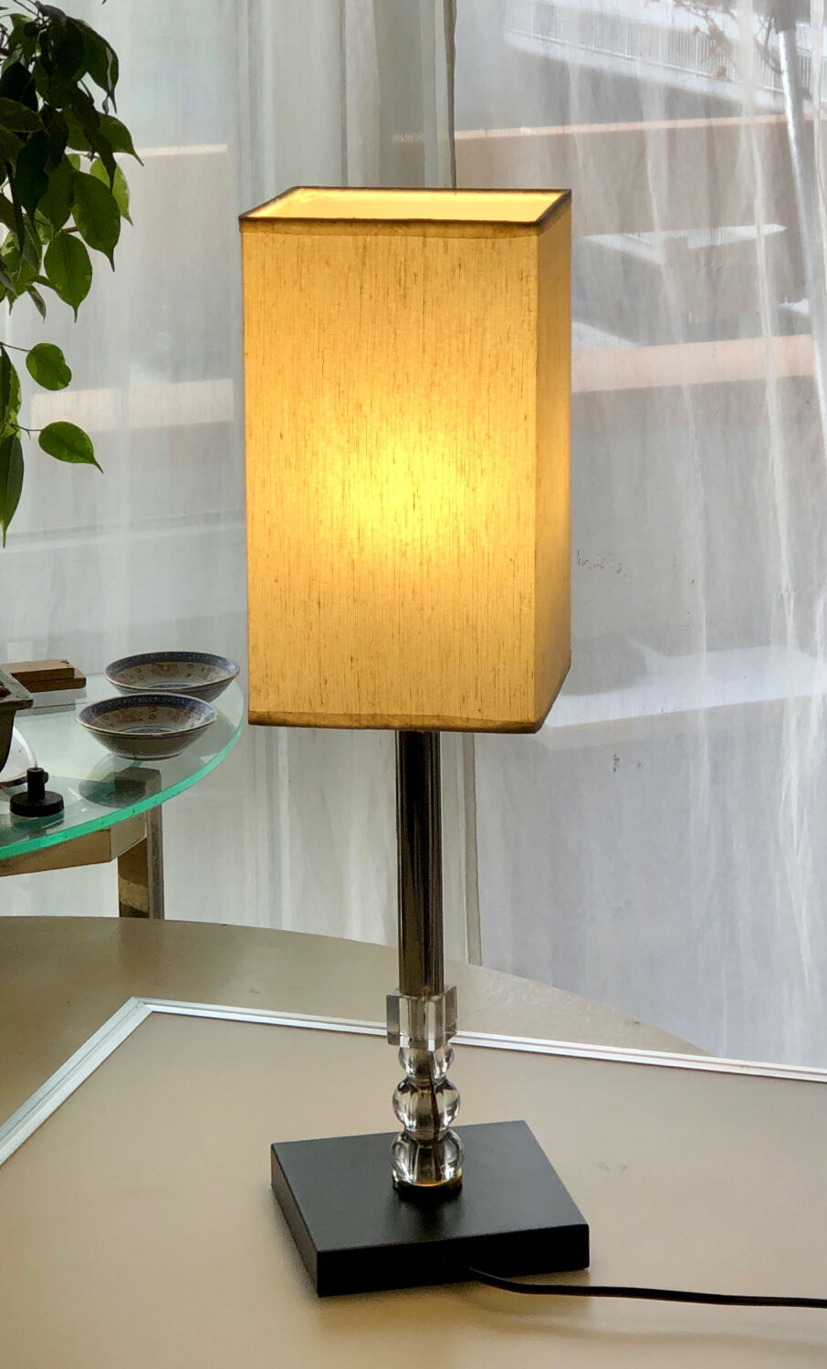 Silver floor lamp with a straight shade.