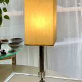 Silver floor lamp with a straight shade.