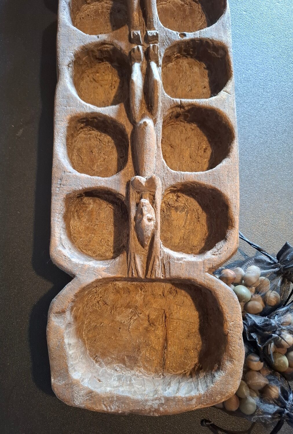 Genuine traditional Awalé made of carved solid wood.