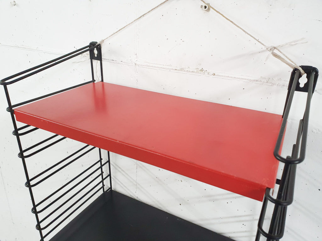 Red and black metal book shelves by Tomado, The Netherlands 1950's