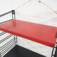 Red and black metal book shelves by Tomado, The Netherlands 1950's