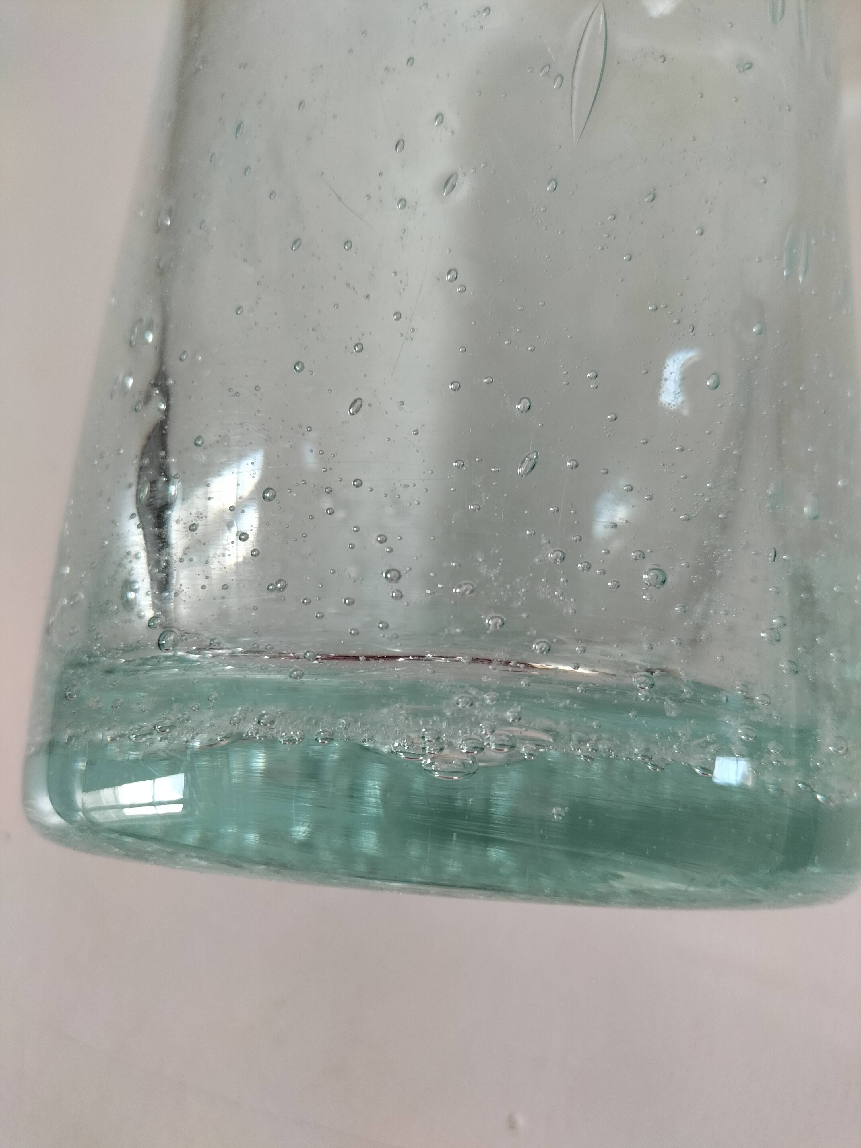 Vintage vase in very pale green bubbled glass, handcrafted
