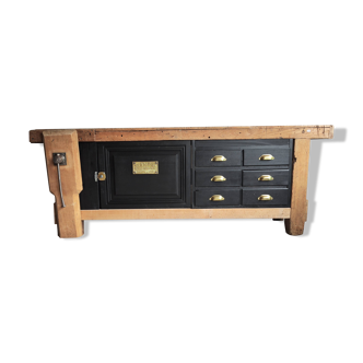 Old workbench furniture with six drawers and a door