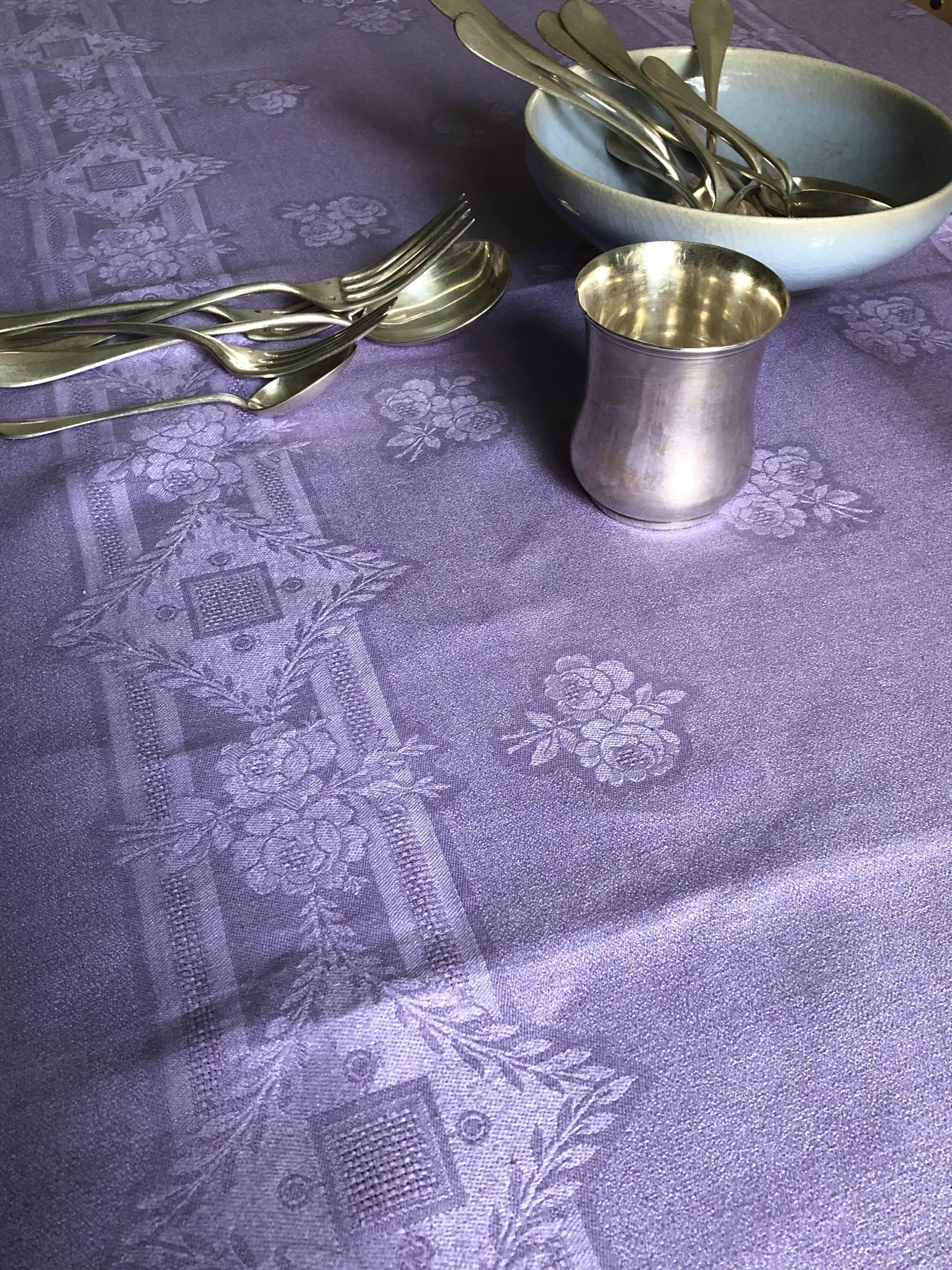 Old damask tablecloth in linen and purple silk