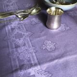 Old damask tablecloth in linen and purple silk
