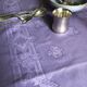 Old damask tablecloth in linen and purple silk