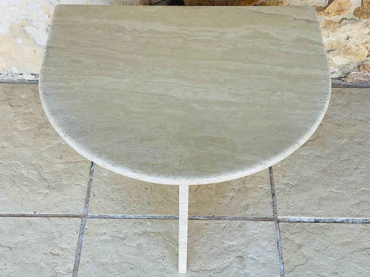 Vintage side table in travertine, circa 1980s.