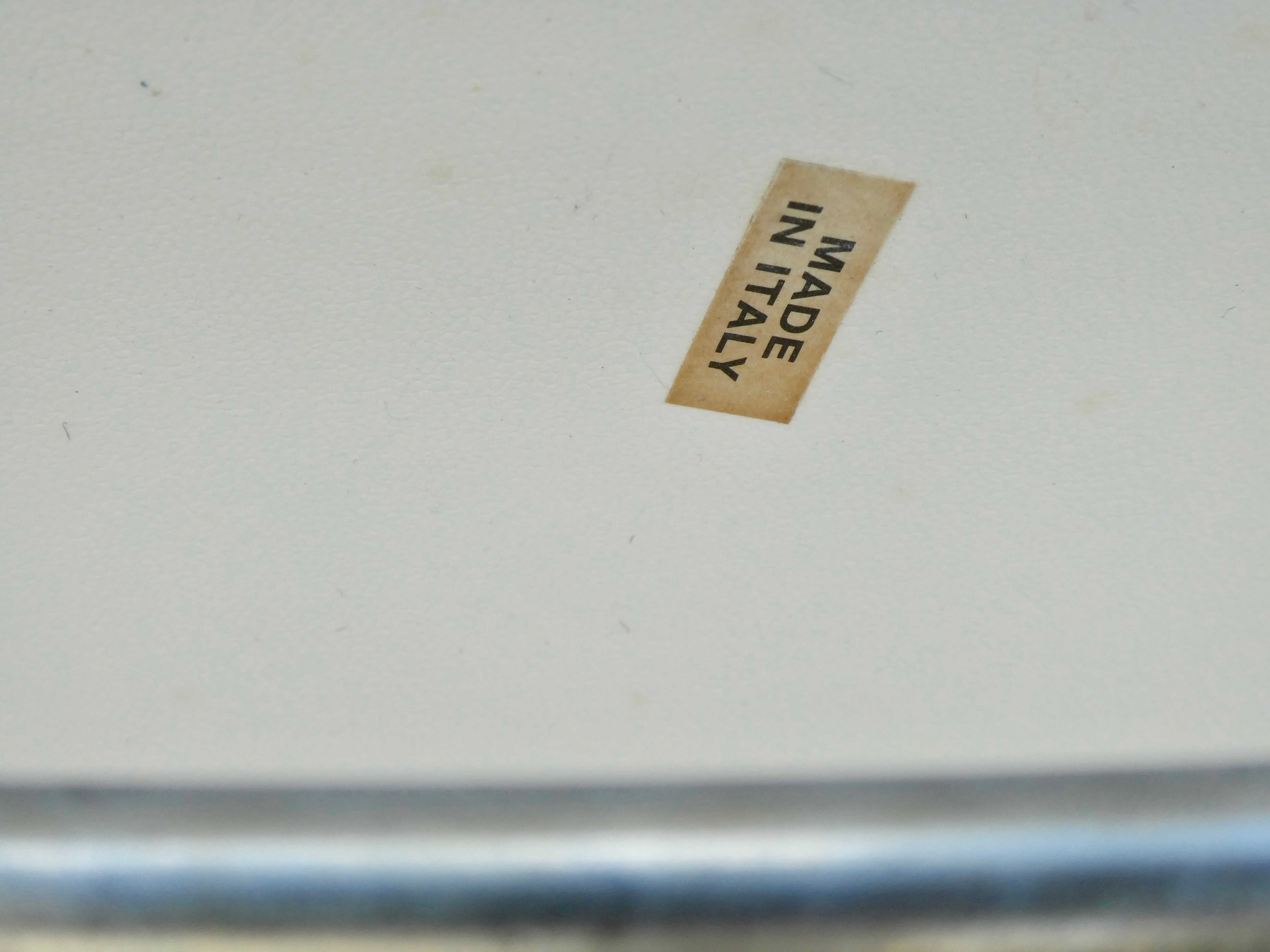 Armchair in chrome and leather