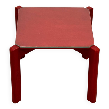 Small red wooden coffee table with glass.