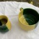 Enameled ceramic bowl and milk jug, two-tone yellow and green, vintage 1950