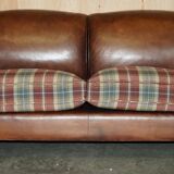 George Smith Signature Scroll leather canapé with tartan Scottish wool cushions.