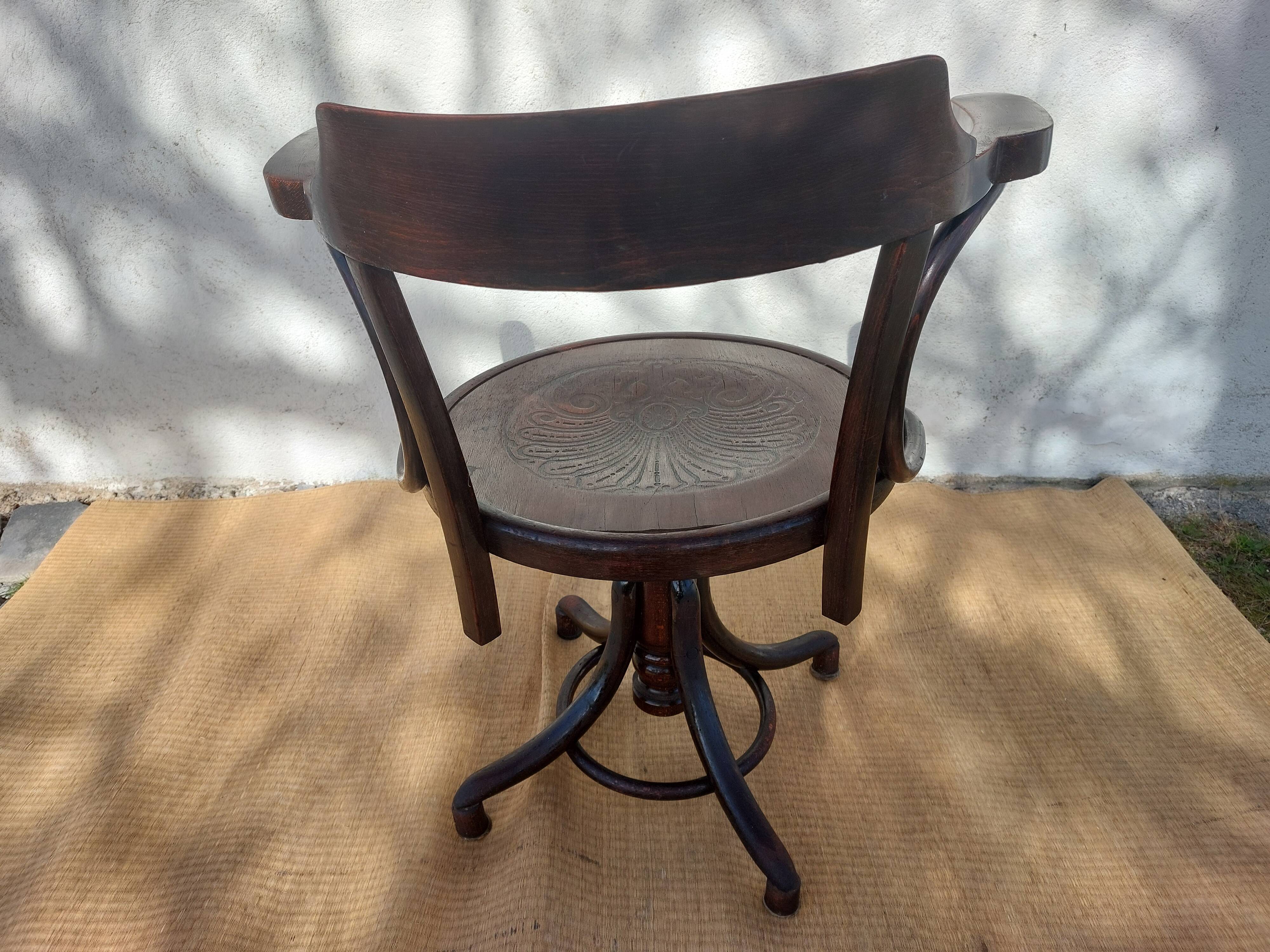 Swivel wooden armchair, pattern on seat