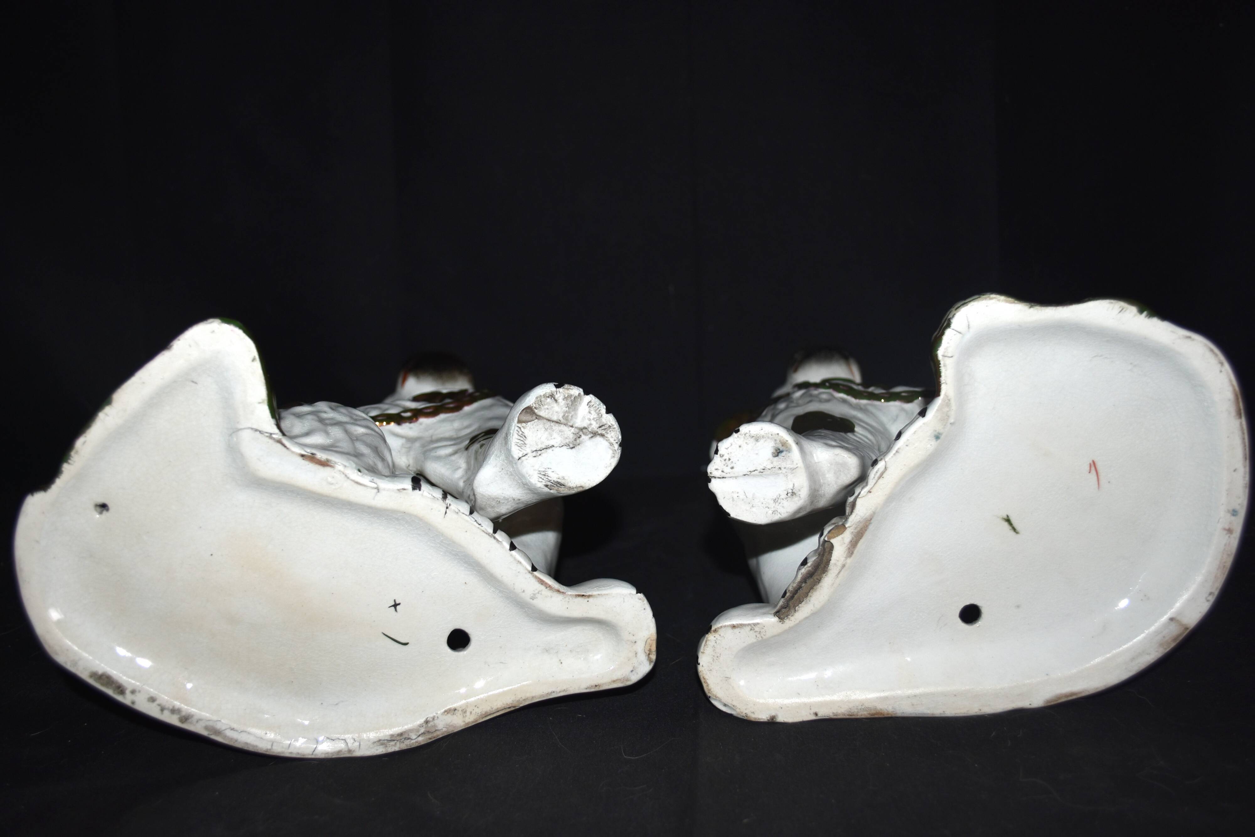 Pair of earthenware dogs (cavalier king charles)