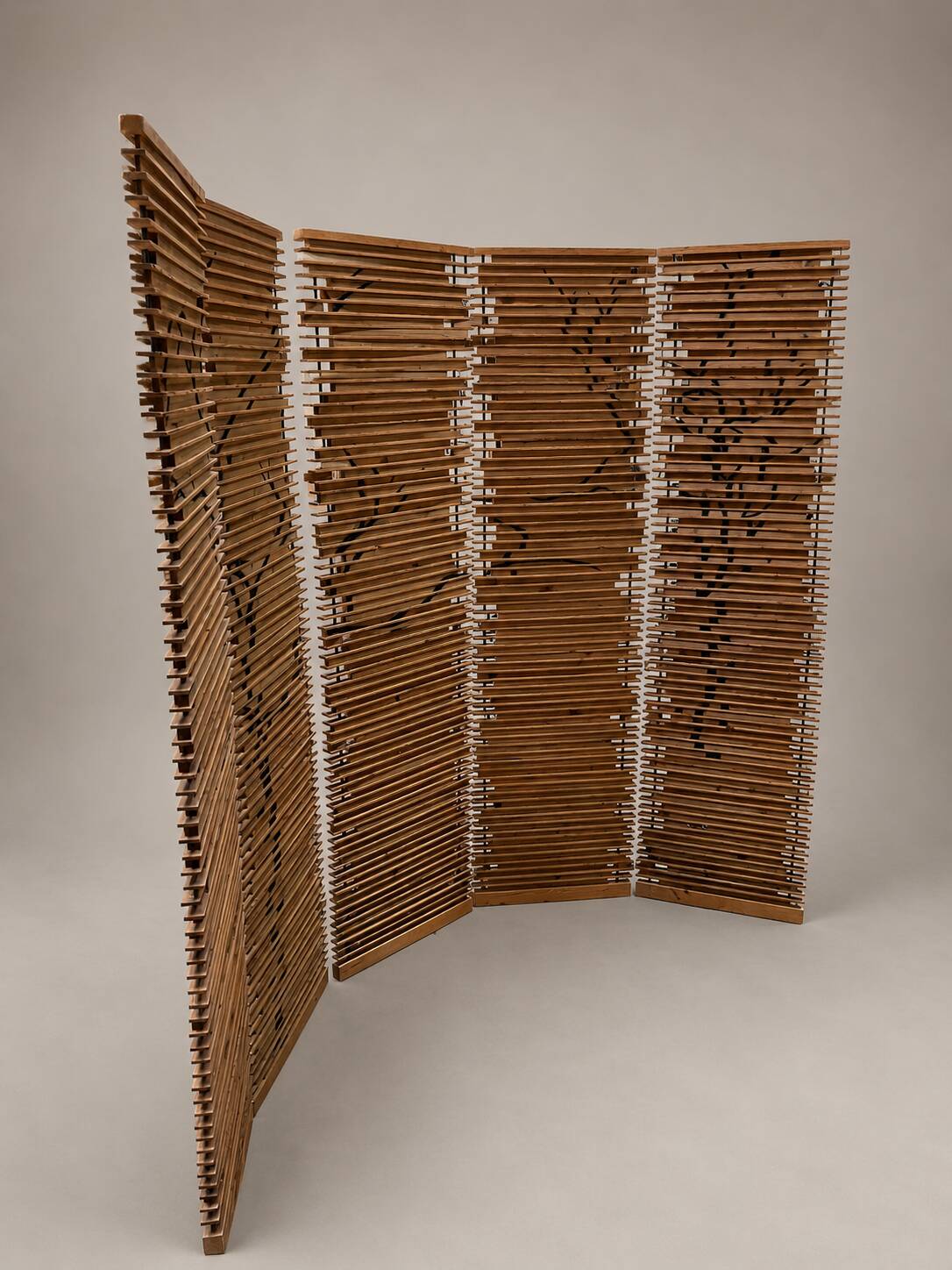 Wooden screen with slats, black plant decoration.